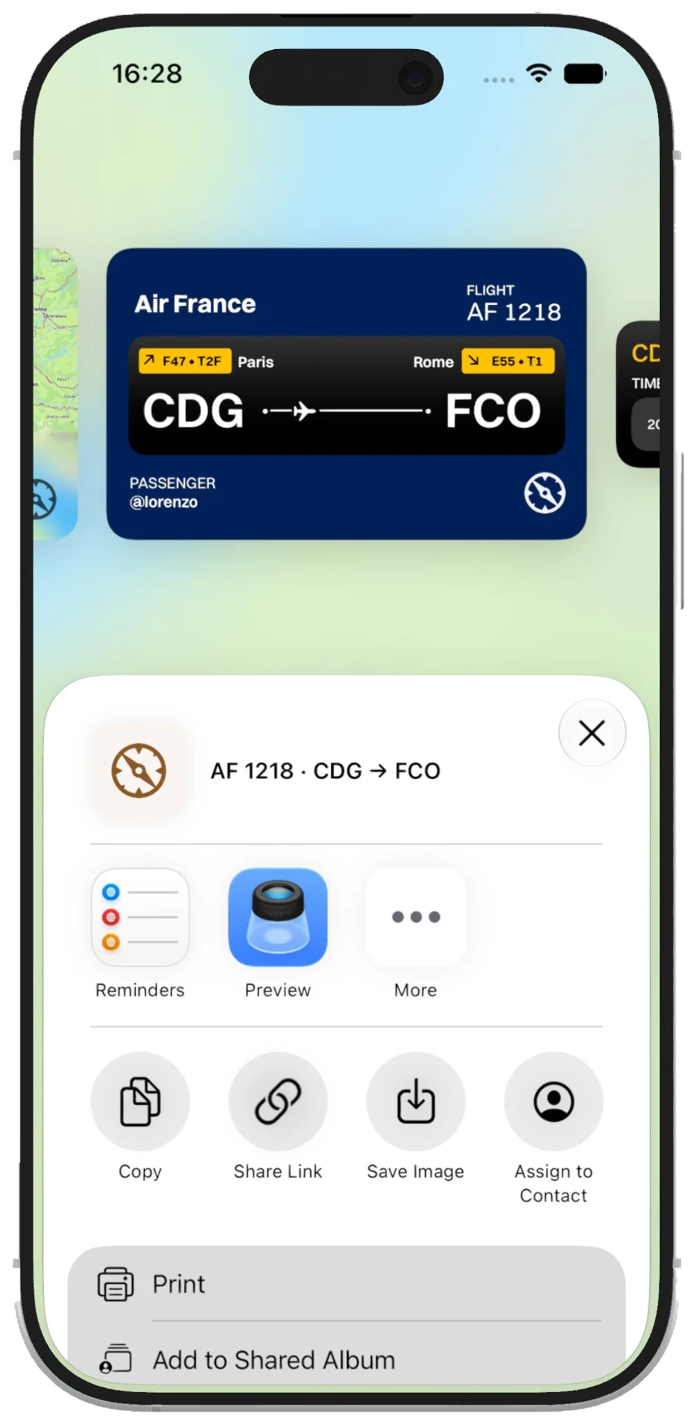 A ticket-style Air France CDG to FCO flight card above the iPhone share sheet